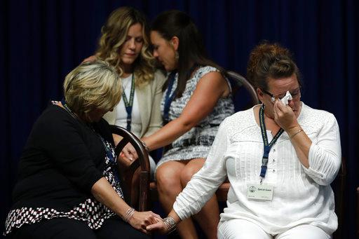 Victims of clergy sexual abuse, or their family members react as Pennsylvania Attorney General Josh Shapiro speaks during a news conference at the Pennsylvania Capitol in Harrisburg, Pa., Tuesday, Aug. 14, 2018. A Pennsylvania grand jury says its investigation of clergy sexual abuse identified more than 1,000 child victims. The grand jury report released Tuesday says that number comes from records in six Roman Catholic dioceses. [Photo: AP /Matt Rourke]